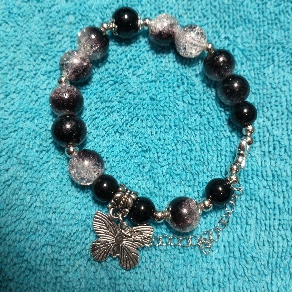 Silvertone butterfly black clear cracked glass beaded stretch bracelet